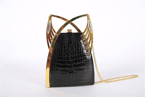 Lalique, Black Crocodile Minaudiere Evening Bag: Lalique (French, established 1888). Crocodile, lambskin. Height: 8 1/2", Length: 5 3/4", Depth: 2 1/8". Black crocodile clutch/evening bag with rigid clasp and stylized chain shoulder strap. Stamped L