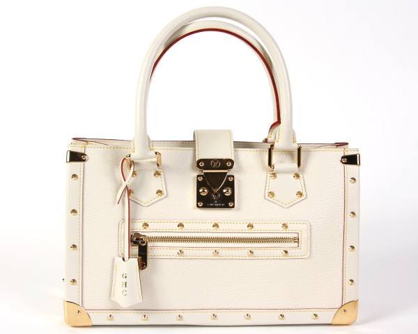 Rare Louis Vuitton "Le Fableaux" Bag: Rare Louis Vuitton "Le Fableaux" bag made of white "Suhali" goat skin leather. Includes original tags, care pamphlet, two keys. Model #M91815. Height 5", length 8 1/2", width 14".