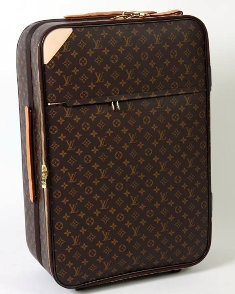 Louis Vuitton "Pegase 70" Rolling Luggage: Louis Vuitton "Pegase 70" rolling suitcase made of monogrammed canvas with natural cowhide trim and polyamide lining. With expandable handle that can be locked in two positions, noiseless wheels, doub