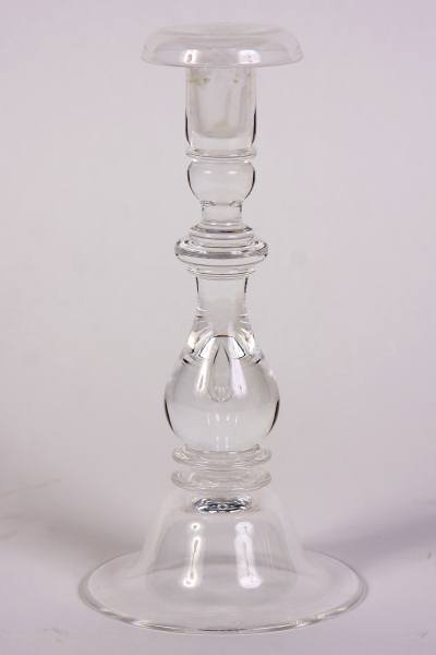 Steuben Glass Candlestick, American, 20th Century: Steuben glass candlestick. American, 20th century. With turned standard and a tear drop. Signed. Height 9".