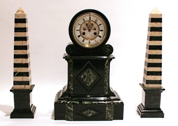 Napoleon III Onyx Clock Garniture, Continental, 19: Napoleon III onyx clock garniture. Continental, late 19th century. With pair of obelisks. Clock height 18”, obelisks height 18 ½”.