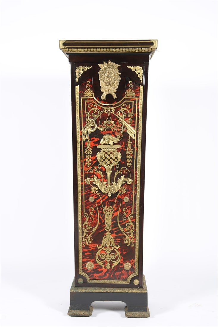 Mahogany Boulle Style Pedestal Column: Mahogany, brass. Height: 52 1/2", Length: 18 3/8", Depth: 13 1/4". Mahogany inlay design with ormolu details and Bacchanalian figure in lion mask. "Heinz C.M. Acc." written on the back.