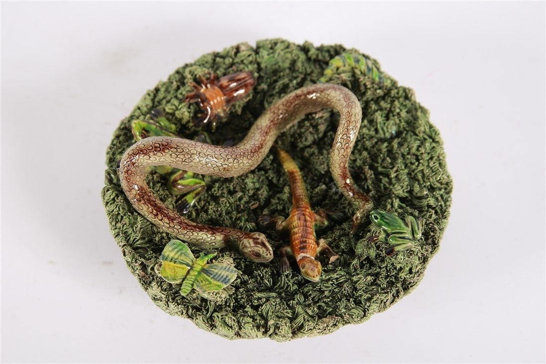 Jose Cunha, Small Majolica Decorative Plate: Jose Alvez Cunha (Portuguese, 19th century). Glazed ceramic. Height: 3 1/4", Diameter: 7 1/2". Decorative Portuguese majolica plate by Jose Cunha. Depicts a snake, lizard, bugs, and frog. Marked with 