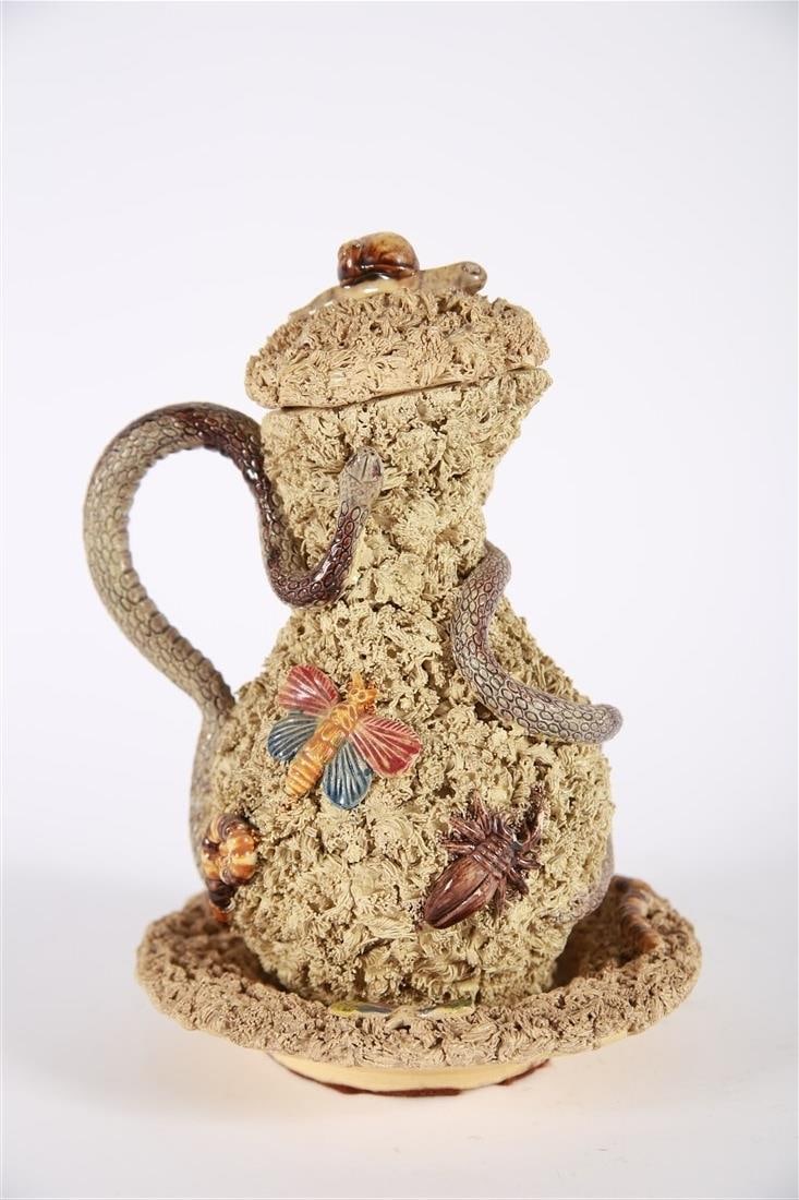 Jose Cunha, Majolica Insect Pitcher: Jose Alvez Cunha (Portuguese, 19th century). Glazed ceramic. Jug: Height: 9", Length: 6". Plate: Diameter: 6 3/4". Textured lidded jug with snakes and insects along with matching underplate. Underplat