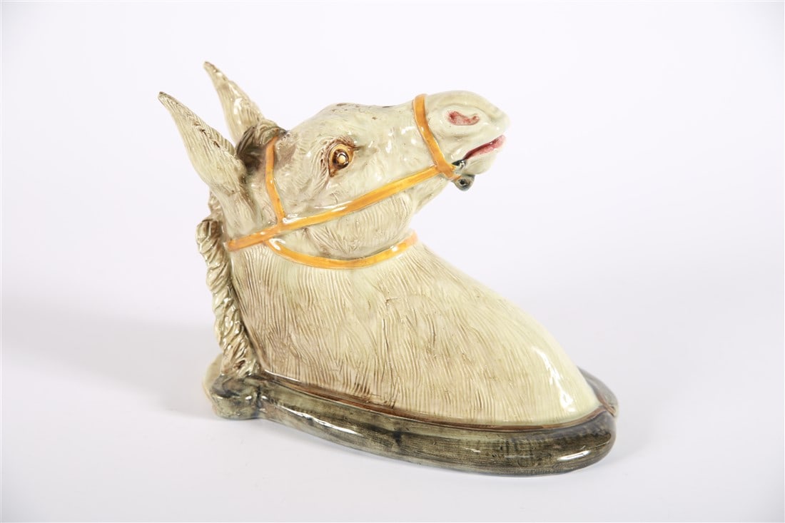 P. Perret Vallauris, Majolica Donkey Wall Pocket: Pierre Perret for Vallauris (French). Porcelain, c. 1890s. Height: 9 1/2", Length: 6", Depth: 7 1/2". Gray donkey with yellow bridle and gray harness. Wall pocket opening at mane. "P. Perret Vellauris