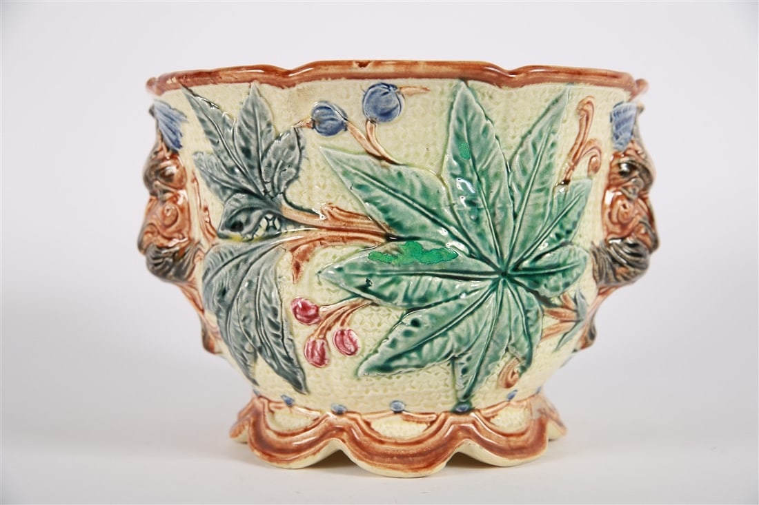 Majolica Jardiniere, Leaf Motif: Porcelain. Height: 7 1/2, Diameter: 10". Jardiniere planter with leaf motif in tan and brown glazes. No apparent markings.