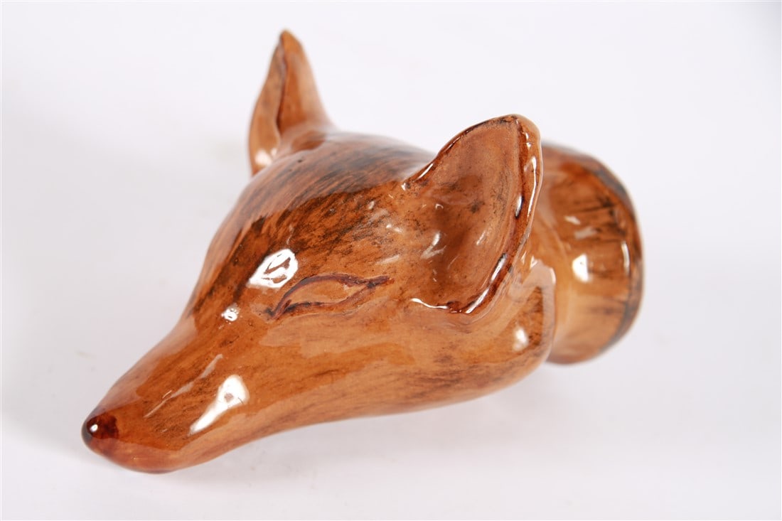 Glazed Ceramic Fox Head Stirrup Cup: Glazed ceramic. Height: 7", Length: 5", Depth: 4". Glazed ceramic stirrup cup in the shape of a fox's head. Appears unmarked.