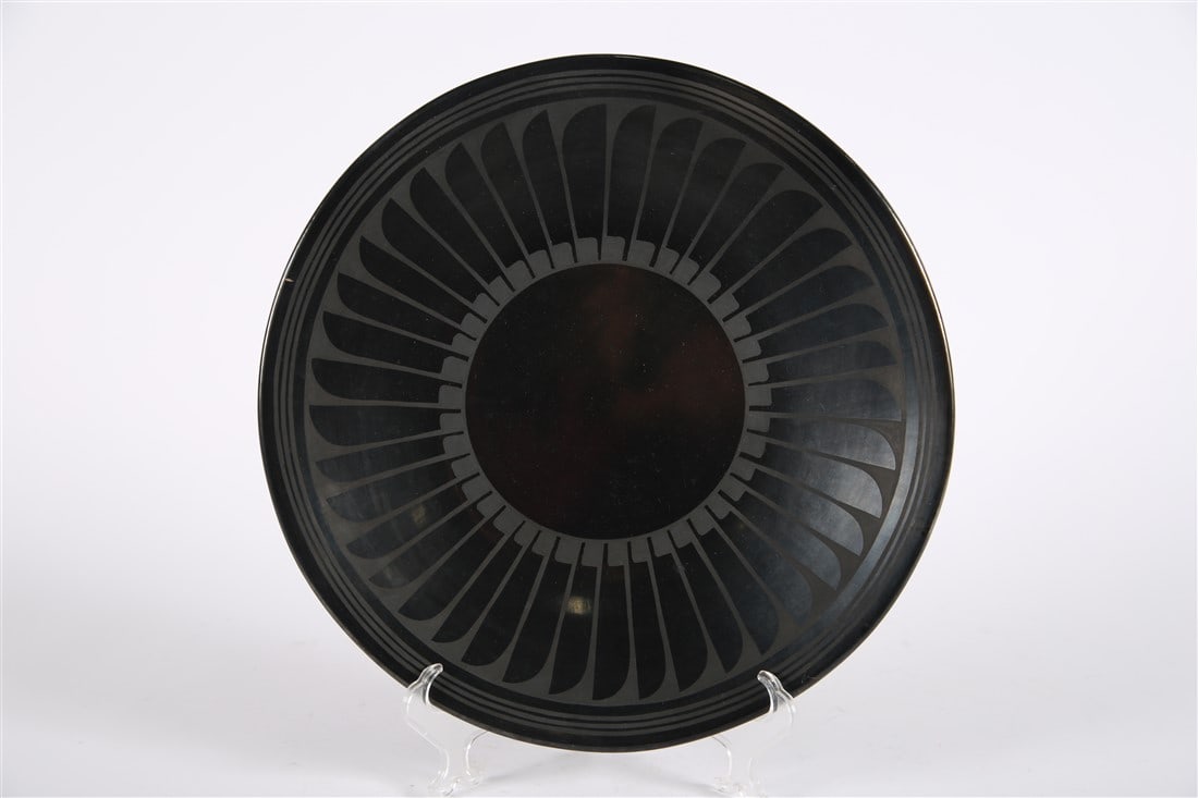 Maria and Santana Martinez, San Ildefonso Plate: Maria Martinez (Pueblo, 1887-1980) and Santana Martinez (1909-2002). Black-on-black pottery, c. 1943-1954. Diameter: 13". Black-on-black San Ildefonso pottery by Maria and Santana Martinez. Geometric