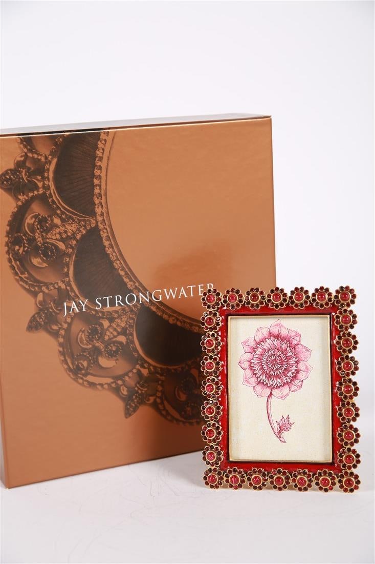 Jay Strongwater, 3x4 Siam Flower Edge Frame: Jay Strongwater (American, established 1995). Enamel, metal. Collection: Classics. Frame: 5" x 3 3/4". Sight: 3 1/2" x 2 1/2". Enamel color is "Siam," which is a maroon, with maroon cabochon gemstones