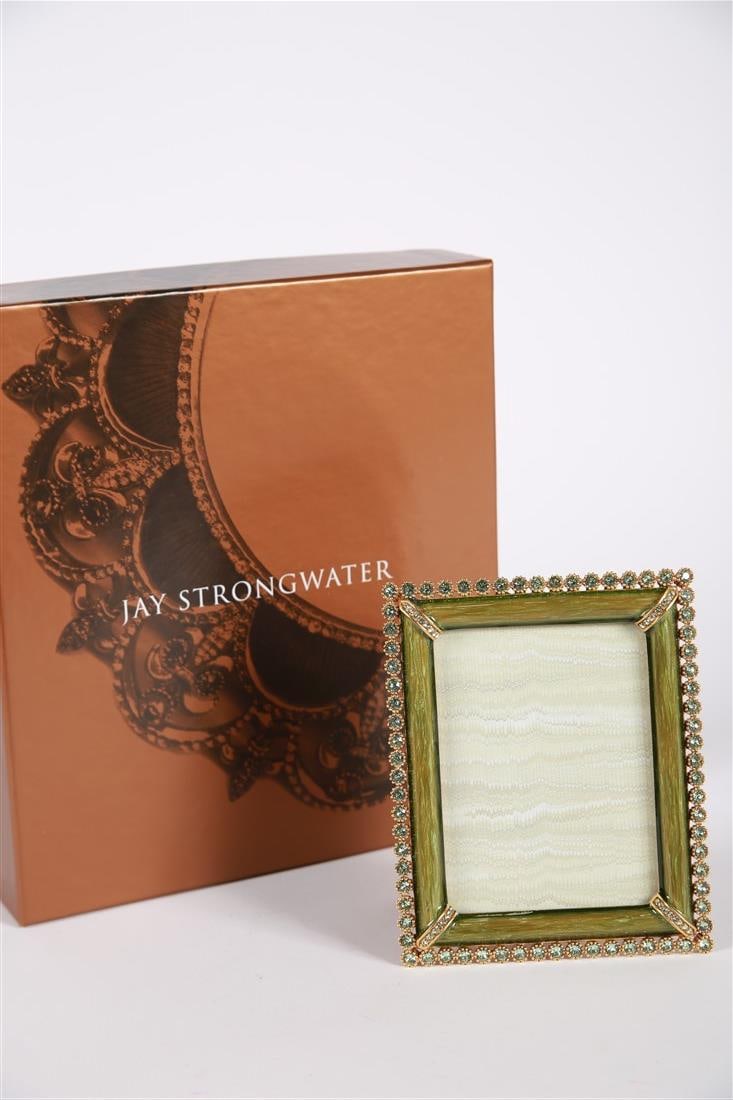 Jay Strongwater, 3x4 Green Stone Edge Frame: Jay Strongwater (American, established 1995). Enamel, metal. Frame: 5 1/8" x 4 1/4". Sight: 3 3/4" x 3". Gold tone metal and green toned enamel surrounded by green rhinestone edge, additional rhinesto