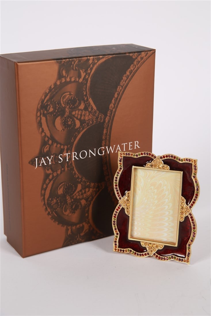 Jay Strongwater, 4x6 Maroon Scalloped Frame: Jay Strongwater (American, established 1995). Enamel, metal. Frame: 7 1/2" x 5". Sight: 5 3/4" x 3 1/2". Deep red/maroon colored enamel with rhinestone embellishments and scalloped shape. Includes box