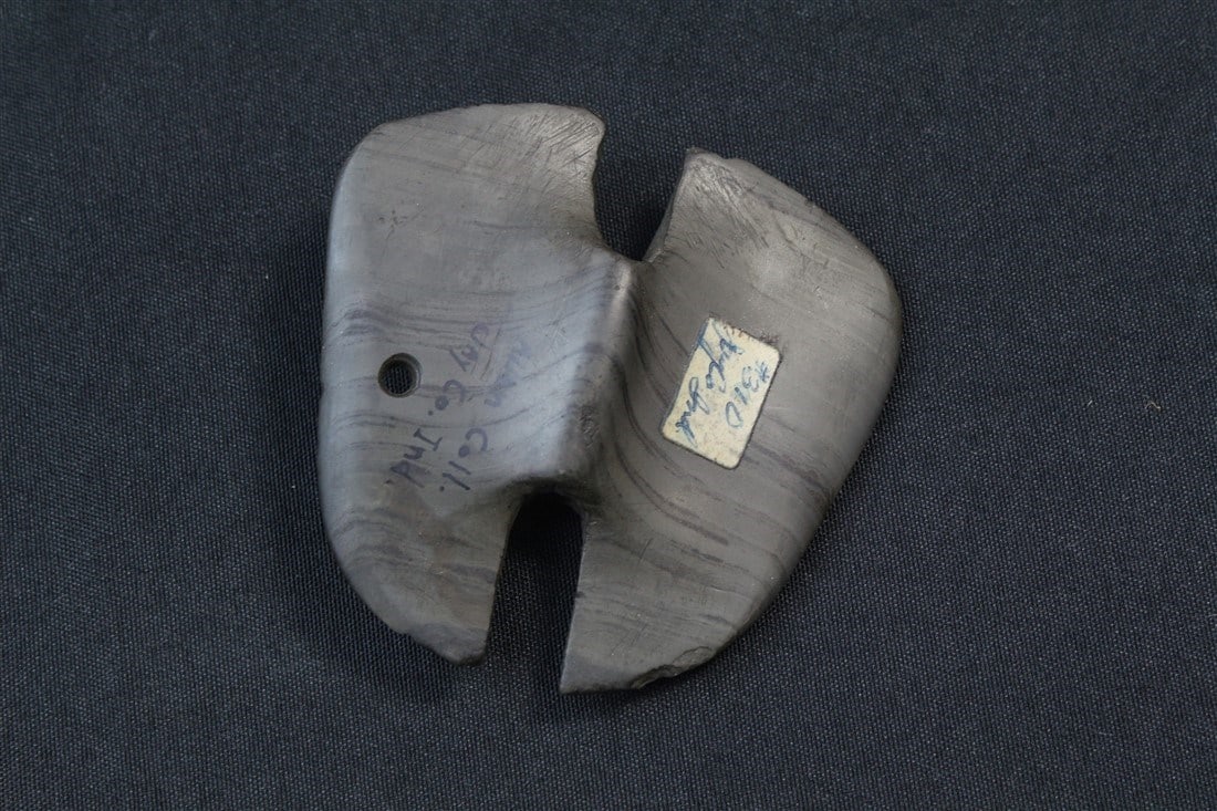 Double Notched Banner Stone: 3 3/8" x 3 1/4". Jay County, Indiana. From the Allen Collection.