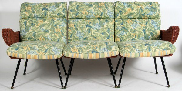 Mid-century Wicker Set, American: Mid-century wicker set. American, 20th century. Including an armchair, three chair settee, cocktail table, side table, and three stacking tables. Largest table height 18", width 28", depth 28".