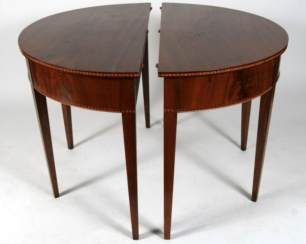Pair Hepplewhite Style Inlaid Demilune Tables: Pair Hepplewhite style inlaid mahogany demilune tables. American, 19th century. The aprons inlaid with dentil borders. Ends to a dining table. Height 28", width 41", depth 20 1/2".