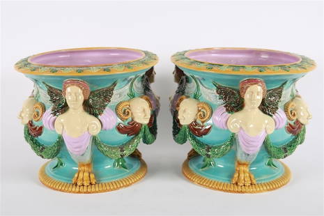 George Jones, Pair of Majolica Jardinieres: George Jones (English, 1823 - 1893). Glazed ceramic. Height: 11", Diameter: 14" each. Pair of majolica jardinieres by George Jones. Depicts harpies and horned creatures to the side. Blue, yellow, gree