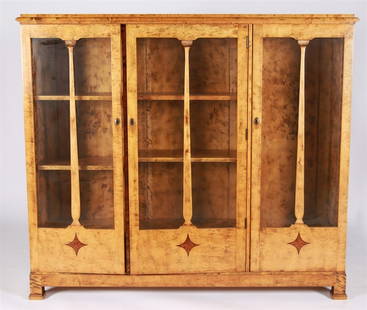 Buffet Cabinet with Inlaid Diamond Designs: Wood, glass. Height: 54 1/2", Length: 62 1/2", Depth: 13 1/4". Three cabinet drawers, the furthest left having three shelves. Blond wood with darker inlaid starburst/curved diamond shapes toward the b