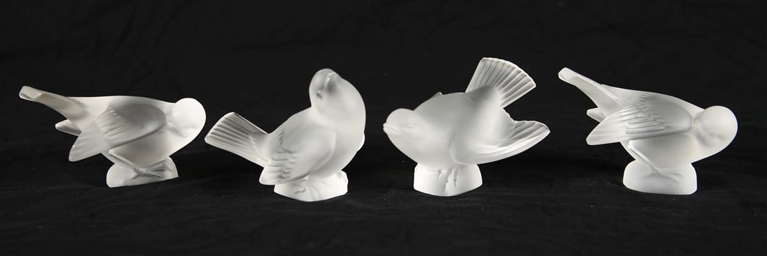 Lalique, Collection of Four Bird Paperweights: Lalique (France, established 1888). Crystal. Tallest: Height: 3 1/4", Length: 4 1/4", Depth: 2". Shortest: Height: 2 3/4", Length: 4 1/2", Depth: 2 3/4". Collection of four Lalique crystal bird paperw