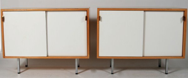 Pair Knoll Maple and Laminate Cupboards: Pair of Knoll maple and laminate cupboards. American, 20th century. Designed by Florence Knoll. With two sliding doors set on chrome feet. Height 27 1/2", width 36", depth 18".