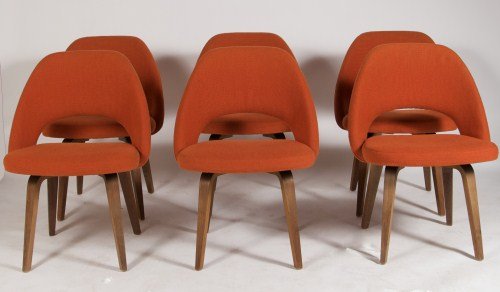 Eero Saarinen Walnut Dining Chairs, Made By Knoll: Set of six Eero Saarinen upholstered and walnut dining chairs. Made by Knoll. American, 20th century.