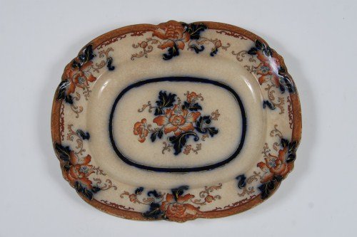 Ironstone Oval Platter, 19th C.: Ironstone oval platter. English, 19th century. With cobalt and orange floral decoration. Length 17".