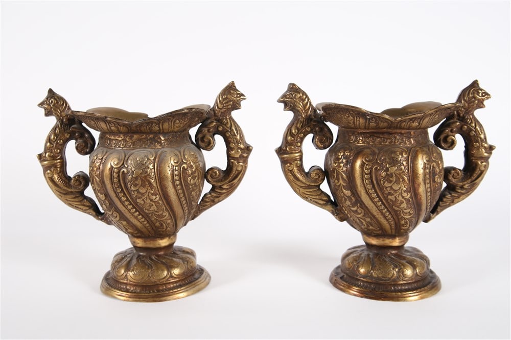 Pair of Brass Dragon Planters: Brass. Height: 12 1/4", Length: 13", Depth: 8". Pair of brass planters with dragon handles and floral motifs.