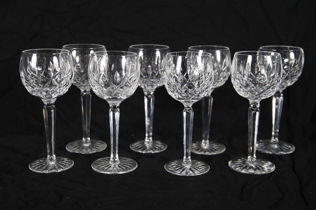 Waterford, "Lismore" Eight Hock Wine Glasses: Waterford (Irish, established 1783). "Lismore" pattern. Crystal. Height: 7 1/2", Diameter: 3". Set of eight (8) "Lismore" hock wine glasses by Waterford. Waterford insignia to the undersides.