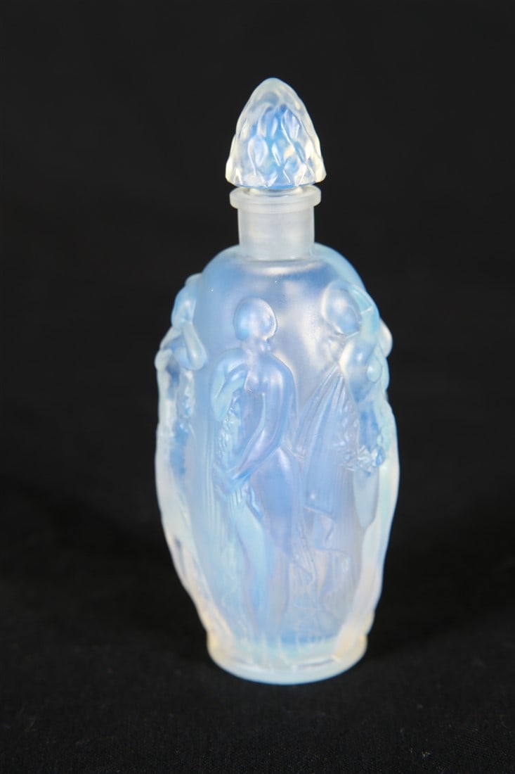 Sabino Art Glass, Opaline Glass Perfume Bottle: Sabino Art Glass (French, established early 20th century). "La Ronde Fleurie" perfume bottle. Glass. Height: 3 3/4", Diameter: 1 1/2". Opaline molded glass perfume bottle by Sabino. Pattern sometimes 