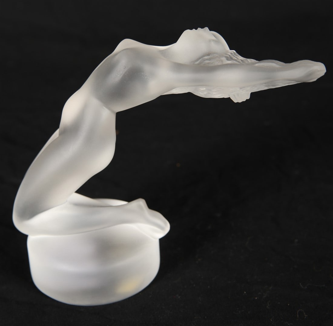 Lalique, "Chrysis" Figurine/Car Ornament: Lalique (French, established 1888). "Chrysis" figurine. Frosted crystal. Height: 5 1/4", Length: 7", Depth: 2 3/4". Frosted crystal "Chrysis" figurine or car mascot by Lalique. Depicts a reclining nud