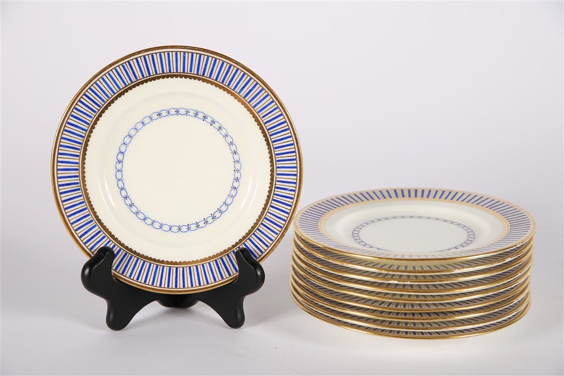 Mintons for Tiffany, Ten Cobalt and Gilt Plates: Tiffany and Co. (American, established 1837). Porcelain. Produced by Mintons. Diameter: 6 1/4". Set of ten (10) Tiffany side plates in cobalt and gilt stripes. Marked with the Mintons for Tiffany insi