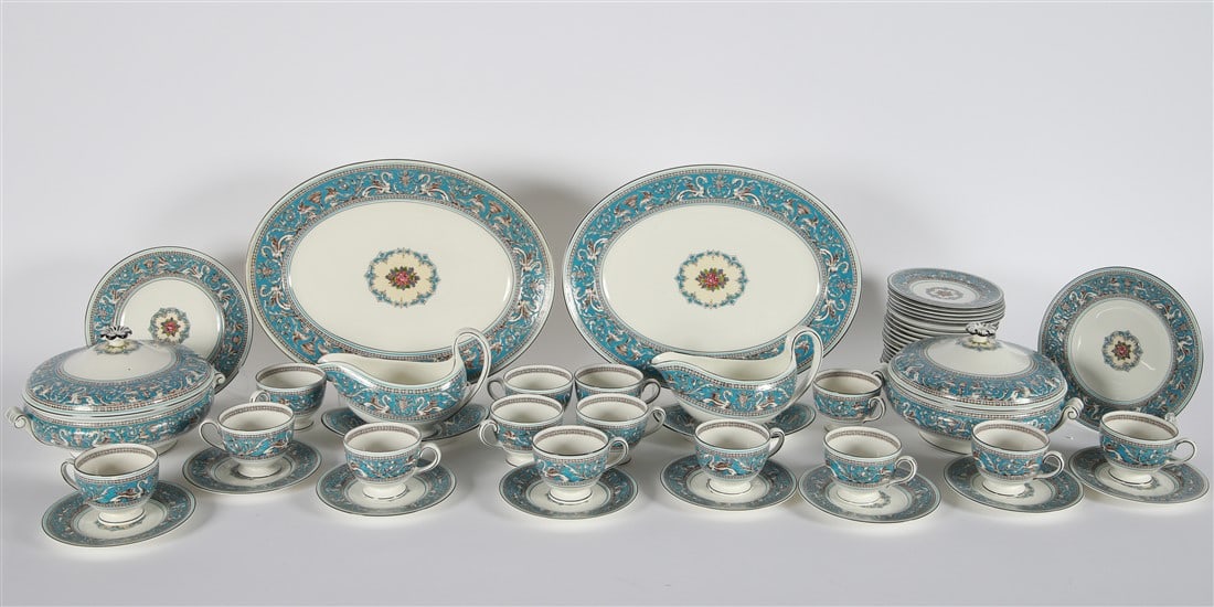 Wedgwood, Blue "Florentine" China Set, 51 Pieces: Wedgwood. Set of "Florentine" china. Porcelain. Pattern no. W2714. Total of 51 pieces. Set of Wedgwood "Florentine" turquoise blue ground with dragons and a fruit center patterned china. Includes the
