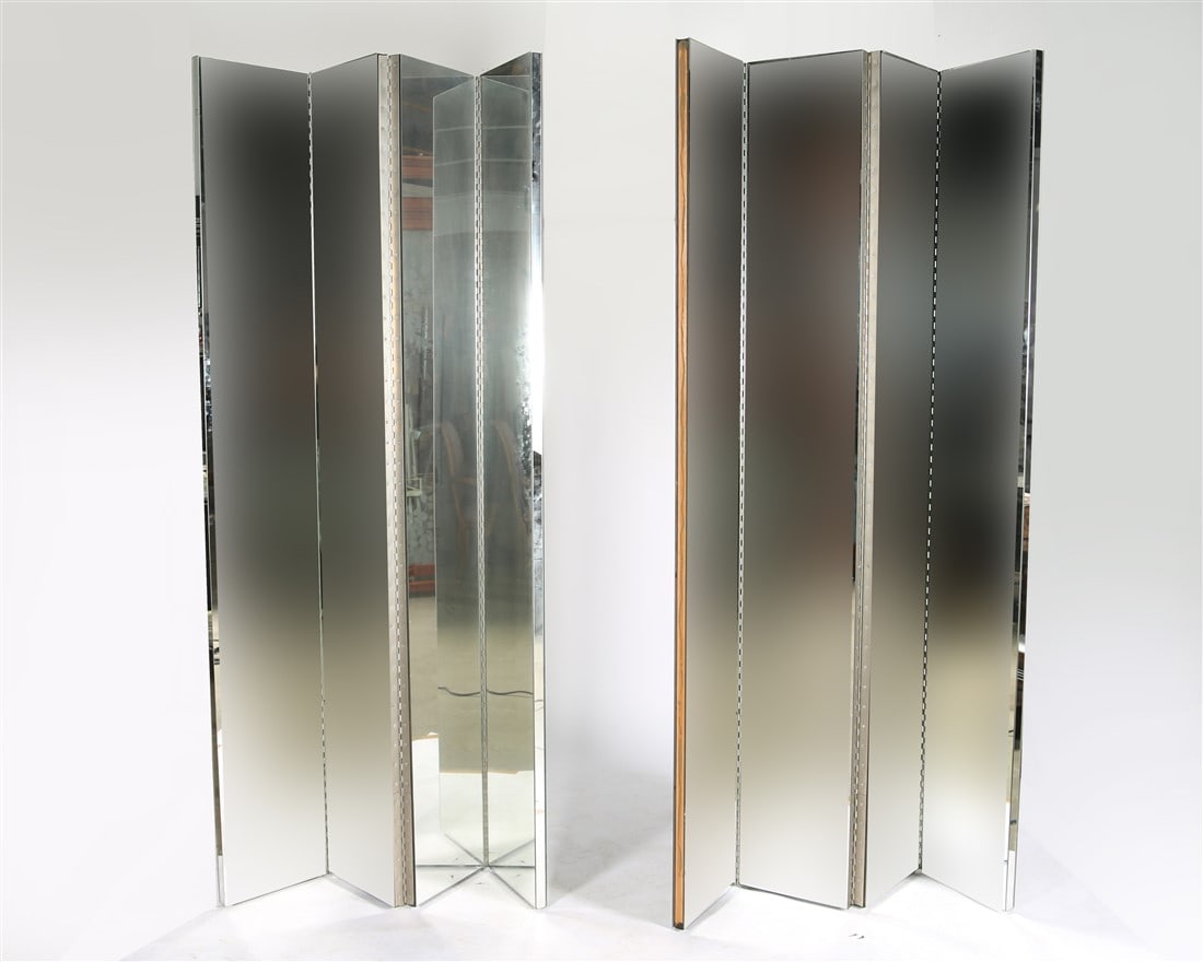 Pair of Mirrored Dividers: Mirrors, metal. Height: 84 1/2", Each Panel Length: 12", Depth: 1 1/2". Pair of mirrored room dividers. Each divider having four panels. Mirrors have been blurred in the photo but are not blurred in p