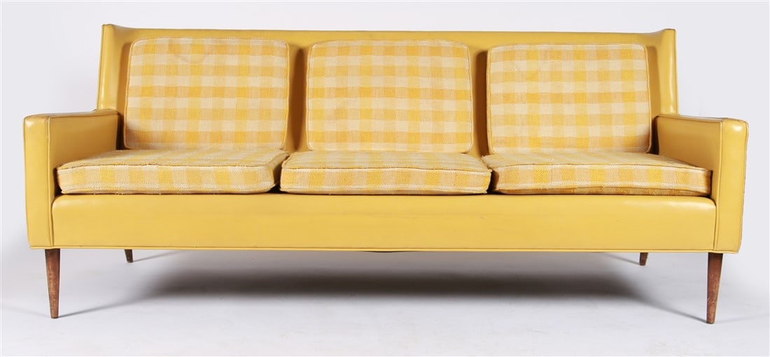 Paul McCobb (American), Yellow Vinyl Sofa: Paul McCobb (American, 1917-1969). Vinyl, walnut. Height: 30 3/4", Length: 73", Depth: 28 1/4". Yellow vinyl upholstered sofa designed by Paul McCobb. Four tapered walnut legs. Three seat cushions, th