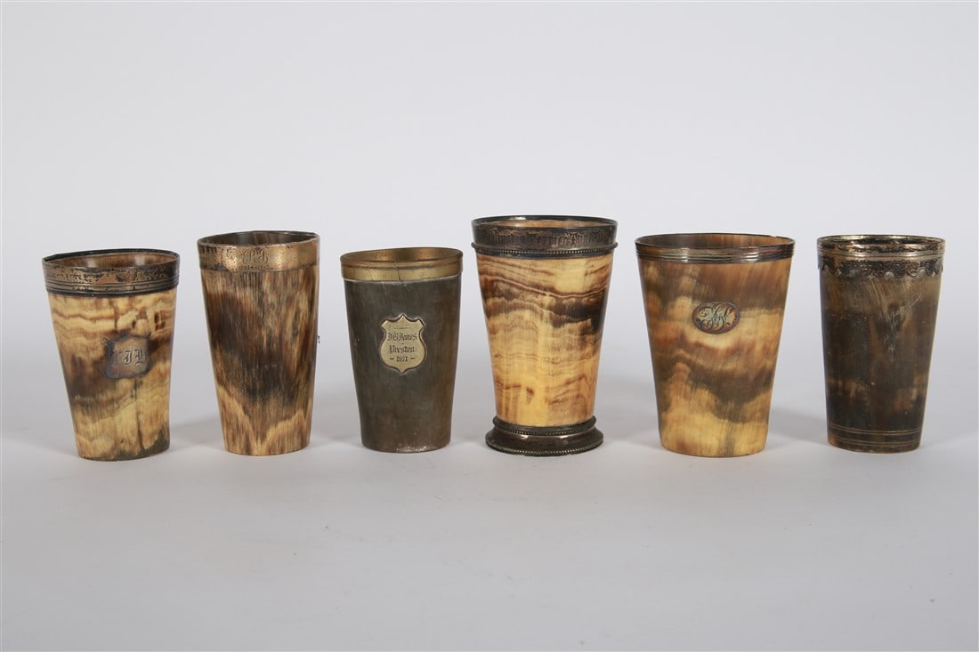 Collection of Six Horn Cups: Horn, silver, brass. Tallest: Height: 5 1/4", Diameter: 3 1/2". Shortest: Height: 4 1/2", Diameter: 2 3/4". Collection of six horn cups, five with silver rims and one with brass detailing. Cups have v