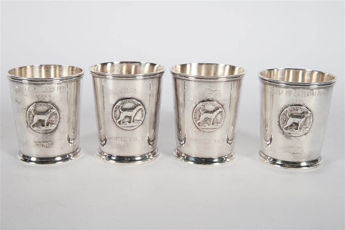 Four Silver Plated Virginia Foxhound Club Cups: Crescent. Silver plate. Height: 3 3/4", Diameter: 3 1/4". Set of four silver plated trophy cups from the Virginia Foxhound Club. Includes the following cups: "Couple of Entered Dogs 1966 Winner", "Sin