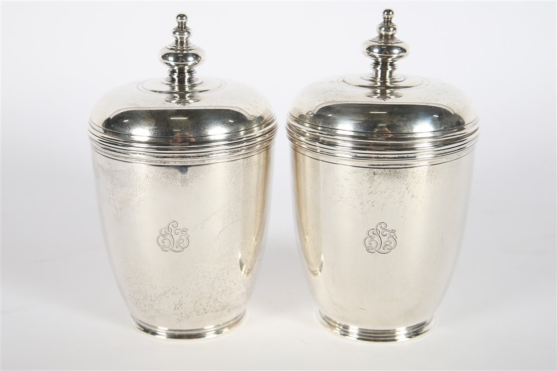 Tiffany and Co., Pair of Sterling Silver Urns: Tiffany and Company (American, established 1837). Sterling silver. Pattern no. 18806 15811. Height: 8 1/4", Diameter: 4 7/8". Total weighable: 42.890 ozt. Pair of sterling silver lidded urns, tea cadd