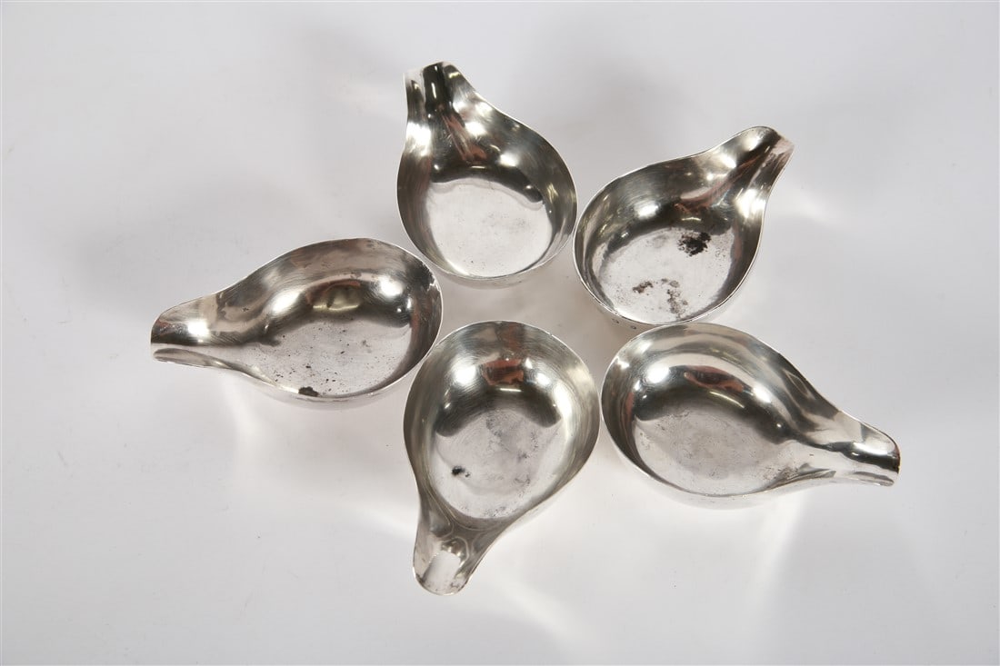 Collection of Five Sterling Silver Pourers: Currier and Roby. Sterling silver. Height: 1 1/4", Length: 4 1/8", Depth: 2 3/4". Weight: 10.025 ozt. Collection of four Currier and Roby sterling silver small pourers and one London, England sterling