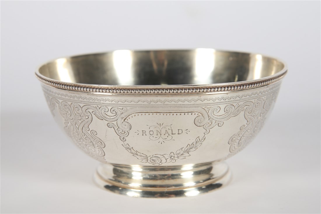 Scottish Sterling Silver Engraved Design Bowl: Sterling silver, 1873. Height: 2 1/4", Diameter: 5". Weight: 4.665 ozt. Scottish sterling silver bowl engraved with scroll and butterfly design and inscribed "RONALD". Edinburgh hallmarks to underside