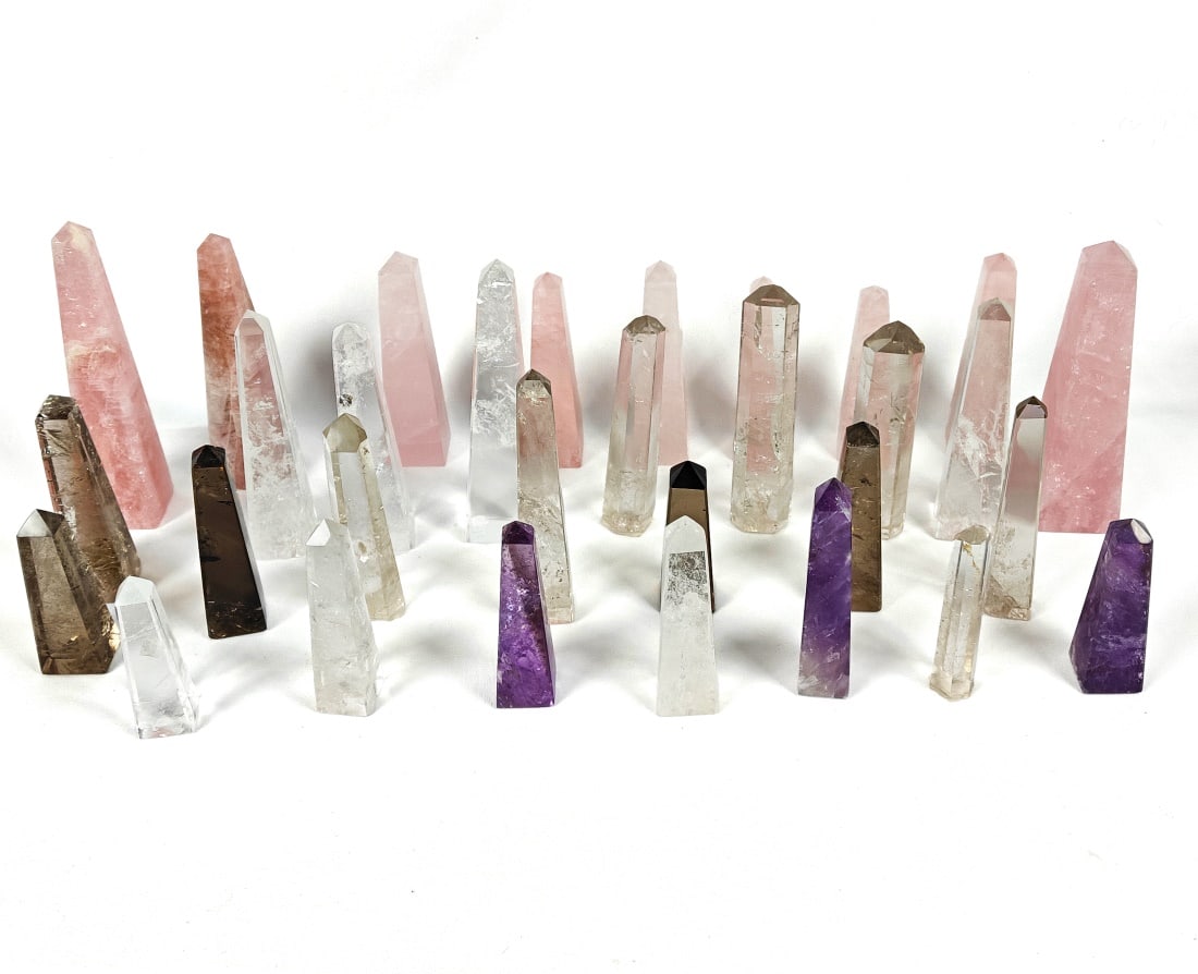 Twenty-One Carved Brazilian Quartz Obelisks: Collection of twenty-one (21) carved Brazilian quartz obelisks. Size and weight vary.