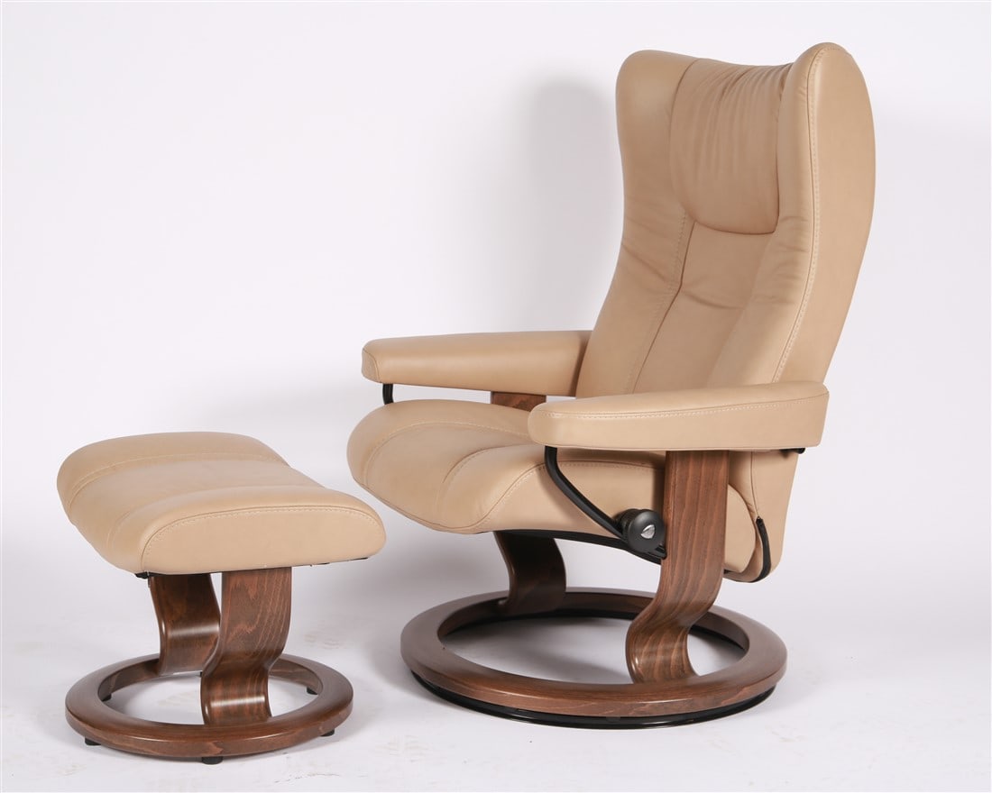 Ekornes, "Wing" Leather Lounge Chair and Ottoman: Ekornes (Norweigan). Stressless "Wing" recliner with ottoman. Leather, wood. Chair: Height: 41", Length: 30", Depth: 26". Ottoman: Height: 15 1/4", Length: 21 1/4", Depth: 17". Ekornes Stressless "Win