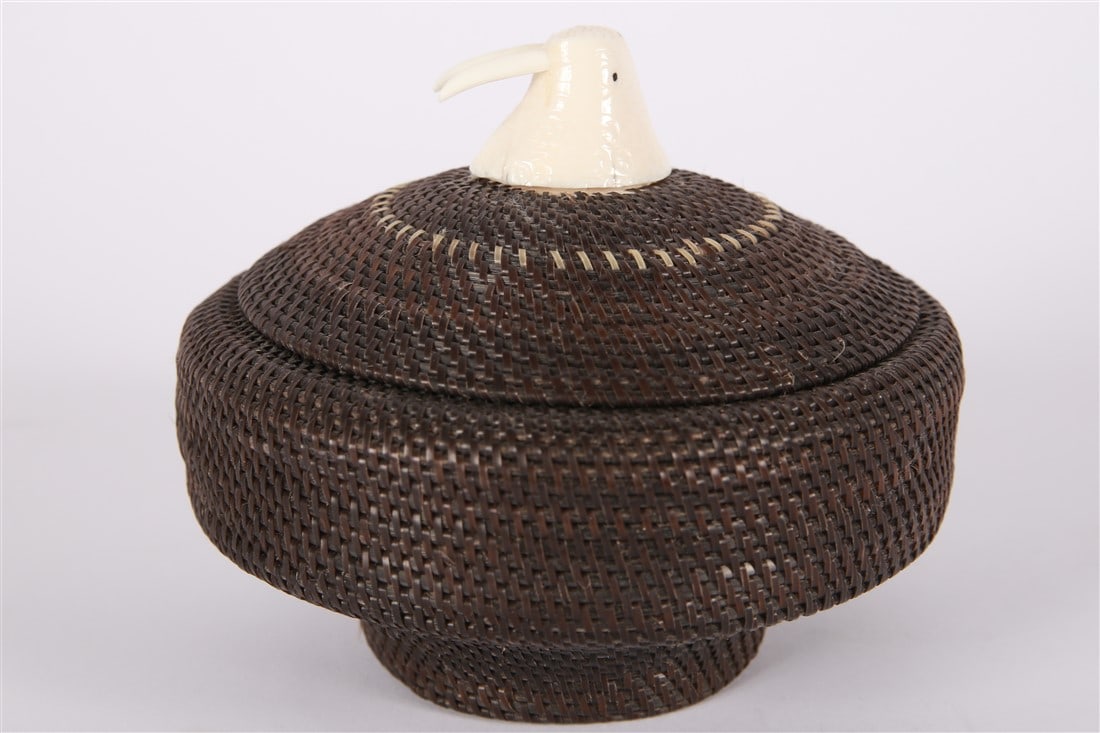 Marilyn Hank Otton (Inupiaq), Woven Baleen Basket: Marilyn Hank Otton (Inupiaq, 20th/21st century). Woven material, bone. Height: 5 3/4", Diameter: 6 1/4". Alaskan woven baleen basket with bone finial in the shape of a walrus. Signed to bone in interi