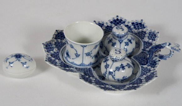 Group of Royal Copenhagen Porcelain Items, 20th C.: Group of Royal Copenhagen porcelain items. Danish, 20th century. In the "Half Lace" pattern. including a beaker, number 2158; salt and pepper casters, number 214; a trifoil dish, number 1077; and a Bi