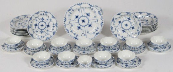 Royal Copenhagen Porcelain Dinner Service, 20th C.: Royal Copenhagen porcelain dinner service. Danish, 20th century. In the "Full Lace" pattern. Including eight dinner plates, eight luncheon plates, eight soup bowls, 11 teacups, 11 saucers, and one han