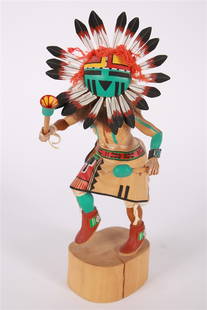 Coolidge Roy, Jr. (Hopi), Tawa Kachina Doll: Coolidge Roy, Jr. (Hopi, 1950-2024). Carved cottonwood root. Height: 15", Length: 6", Depth: 7 1/2". Carved and painted root Tawa or Sunface Kachina doll by Hopi artisan Coolidge Roy, Jr. Signed to th