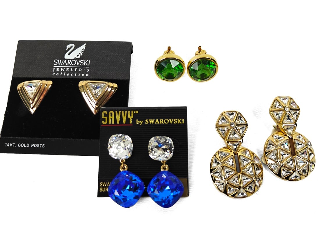 Swarovski, Four Pairs of Earrings: Swarovski, four pairs of earrings. Various designs and colors. The sets are clip-ons, the others are standard.