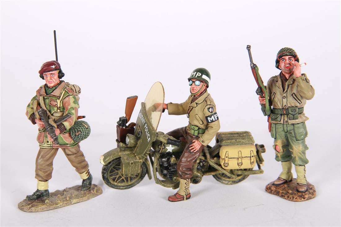King and Country, Three Military Figurines: King and Country. All figures around 3" x 2" x 1". Three military figurines. One King and Country "Operation Market Garden" from 2007, one King and Country "D Day 44" from 2012, and one military polic