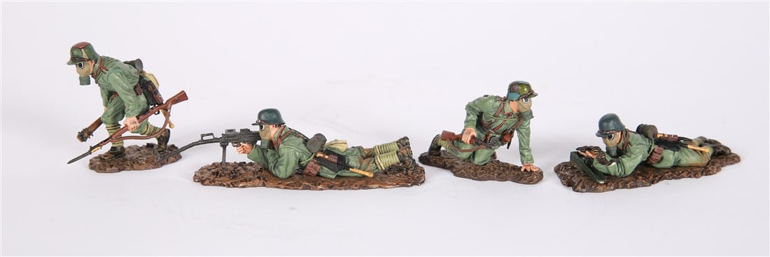 Thomas Gunn, WWI Germans with Gas Masks: Thomas Gunn Miniatures. Each piece roughly 3" x 2" x 1 1/2". Four piece set of Thomas Gunn Miniatures figurines depicting German WWI soldiers with gas masks. Marked to the undersides.