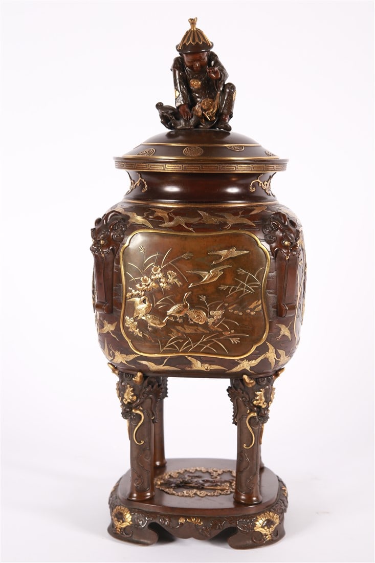 The Miyao Eisuke Company, Bronze Koro: The Miyao Eisuke Company (Japanese, established 19th century). Bronze. Height: 21 1/2", Length: 8", Depth: 8". Bronze koro on four legs with a seated figure finial. Motif of cranes to the side of the 