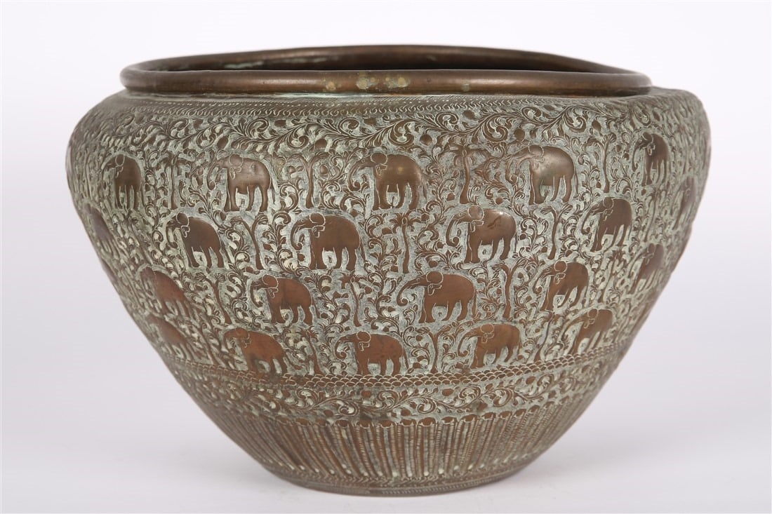 Hammered Metal Elephant Bowl: Metal. Height: 9", Diameter: 14". Hammered metal bowl with incised elephant design.