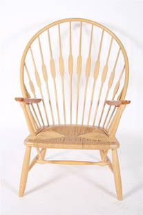Hans Wegner for Johannes Hansen, "Peacock" Chair: Hans Wegner (Danish, 1914-2007). "Peacock" chair. Ash wood, teak, cord. Produced by Johannes Hansen. Height: 41 1/2", Length: 30 1/2", Depth: 25". Hans Wegner "Peacock" armchair with ash wood body and