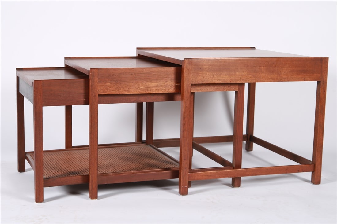 Set of Three Walnut Mid-Century Nesting Tables: Walnut, caning. Tallest: Height: 20 3/4", Length: 24", Depth: 24". Set of three mid-20th century walnut nesting tables. Smallest table has a single drawer and a cane shelf. Appears unmarked.